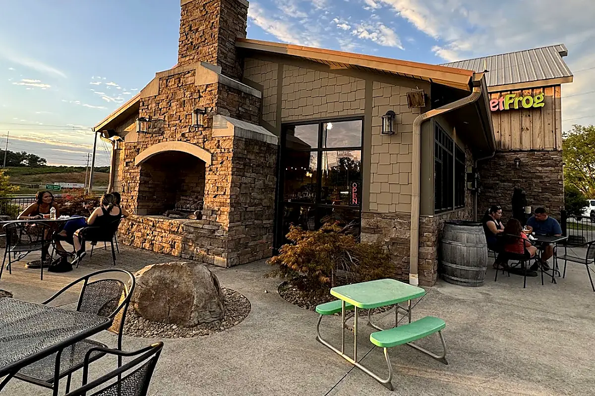 The stone fireplace patio at Smoky Mountain Espresso, 1259 Middle Creek Rd, at sunset